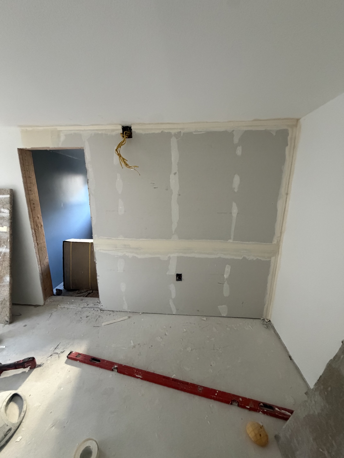 Drywall installation and finishing during a remodel