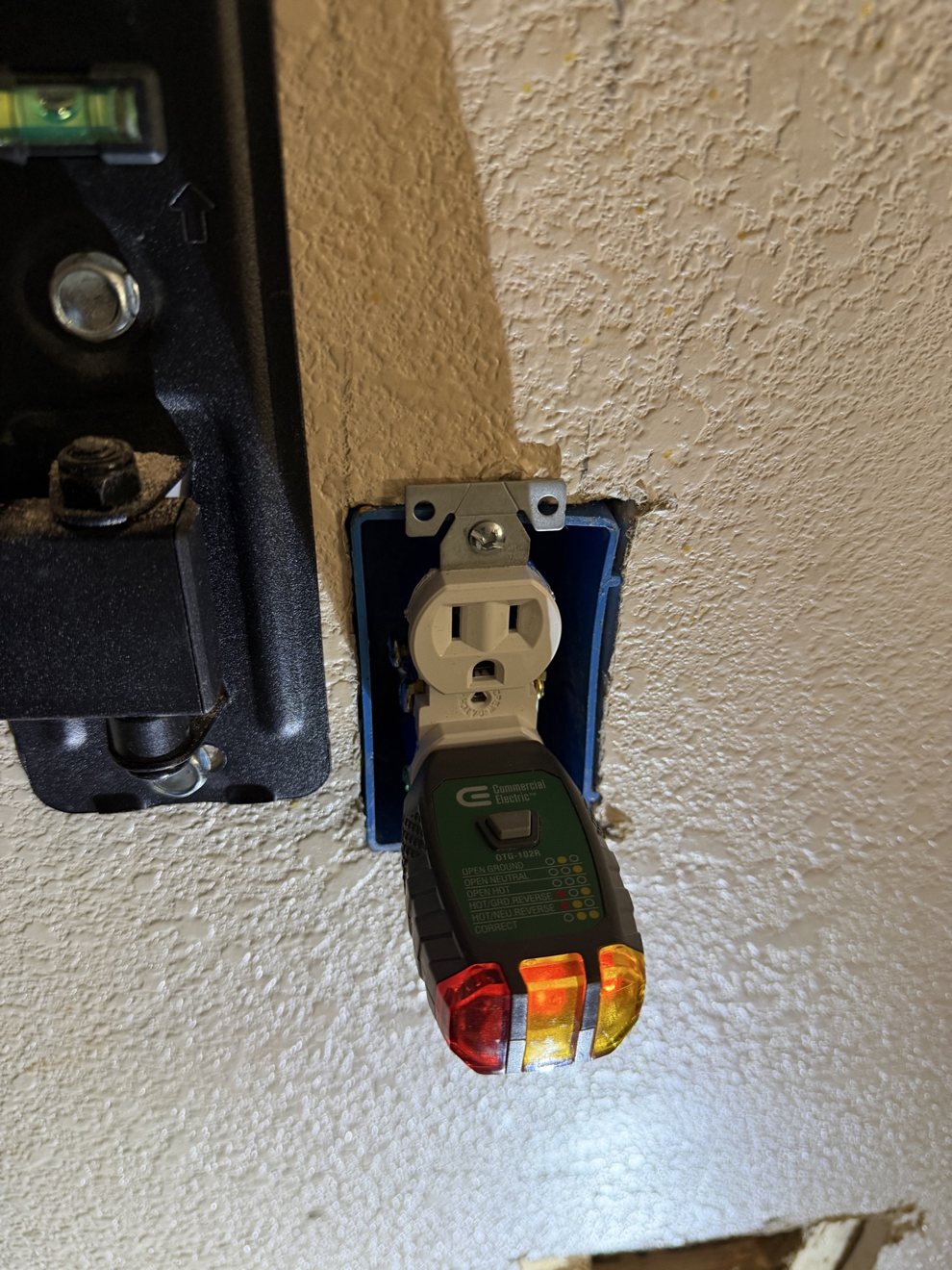 New electrical outlet installed and verified with a receptacle tester