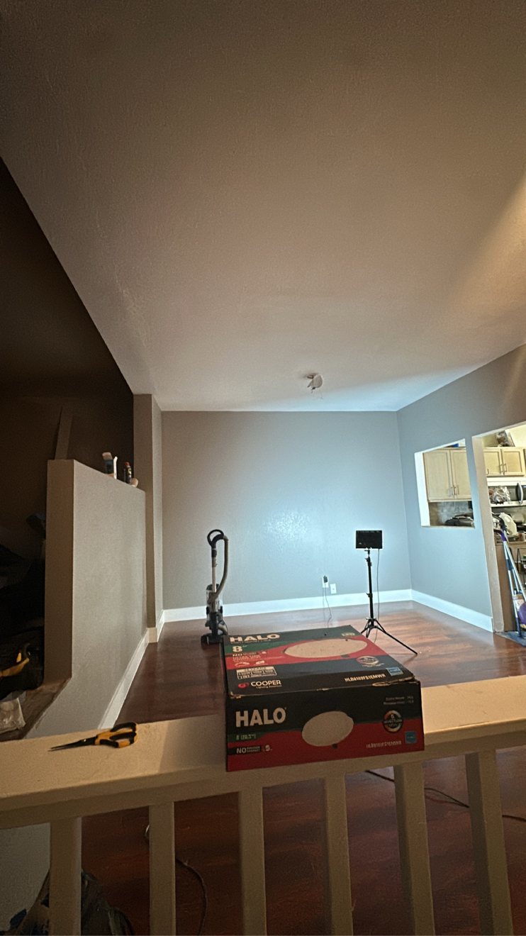Finished room remodel with fresh paint and new wood floors