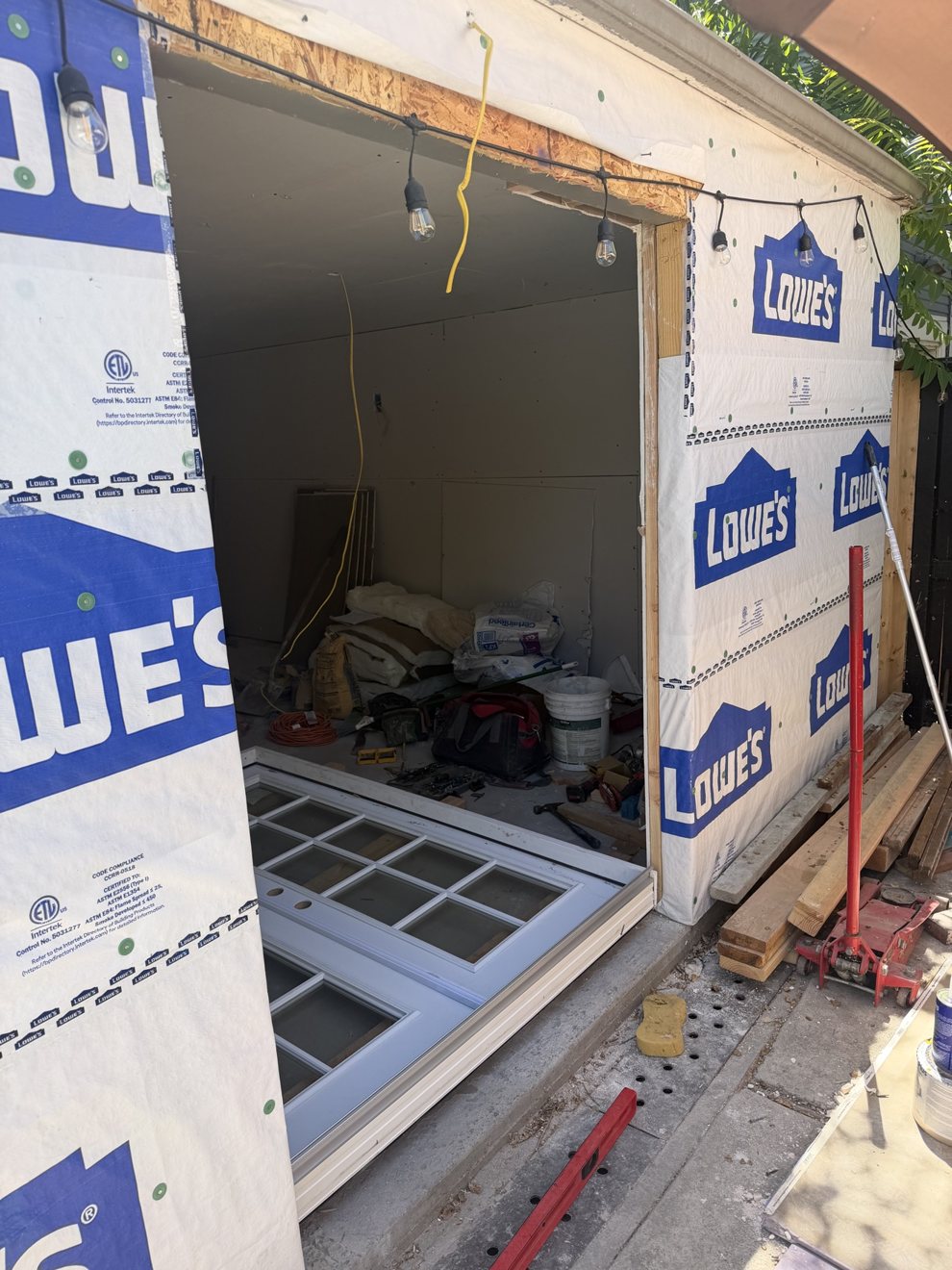 Shed build in progress with French doors ready to install