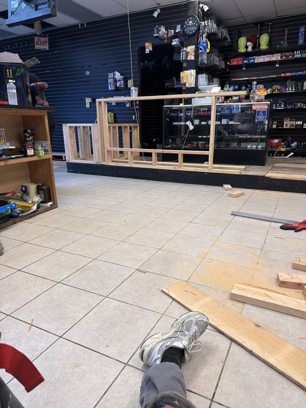 Wooden counter framing being built inside a retail store