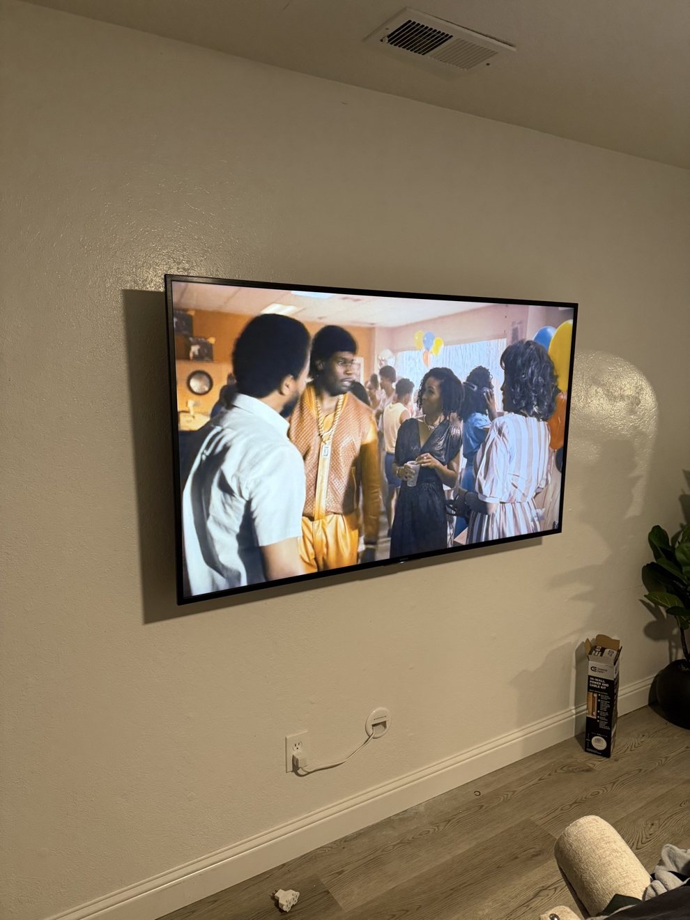 Wall-mounted TV with cables concealed in the wall